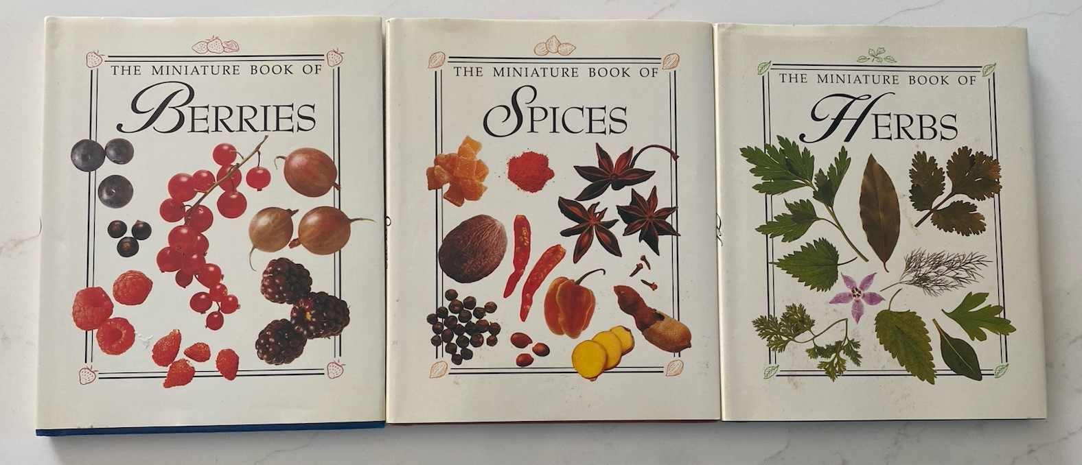 3 Mini books detailed botanical illustrations. titles Berries, Spices, & Herbs.